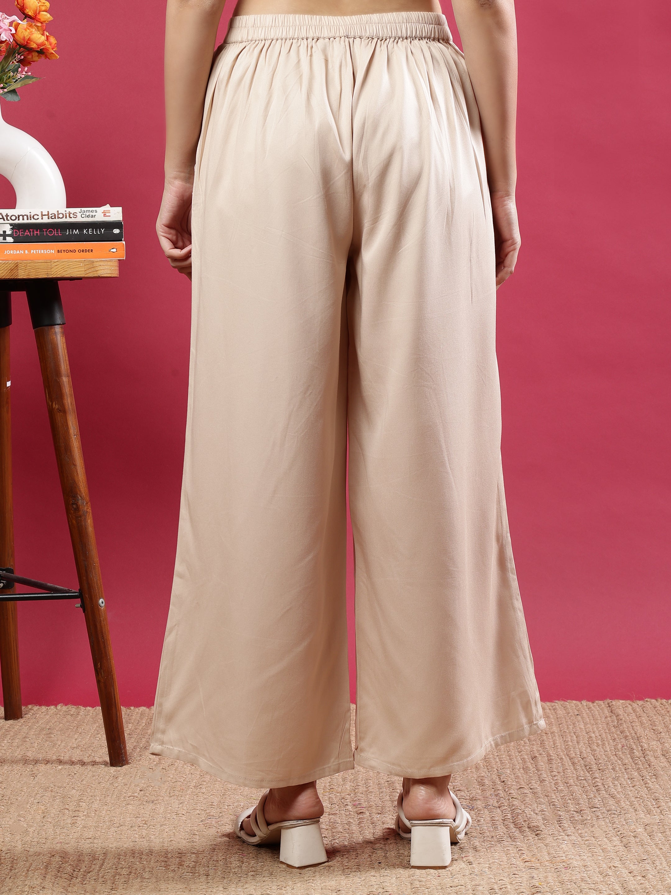 Cream Flared Solid Palazzo Pants with Side Pockets